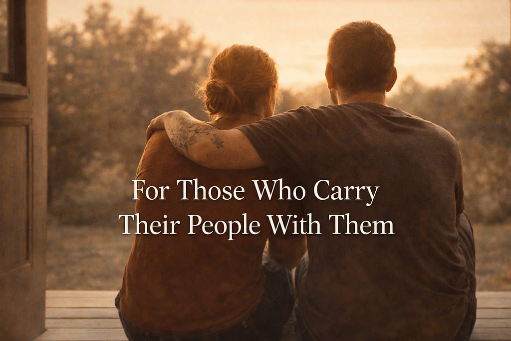 Two people sitting together on a porch step in golden afternoon light with a memorial tattoo visible on one forearm showing quiet devotion after loss