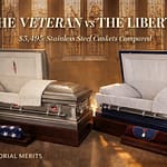 The Veteran platinum finish stainless steel casket beside The Liberty midnight blue stainless steel casket in a military memorial hall side-by-side comparison from Discount Caskets