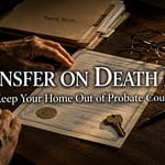 Homeowner reviewing a transfer on death deed form at a desk with a house key resting on the property paperwork