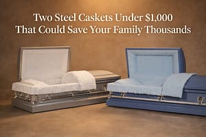 Silver steel casket with white crepe interior next to light blue steel casket with blue crepe interior displayed side by side in a warm showroom setting for product comparison review